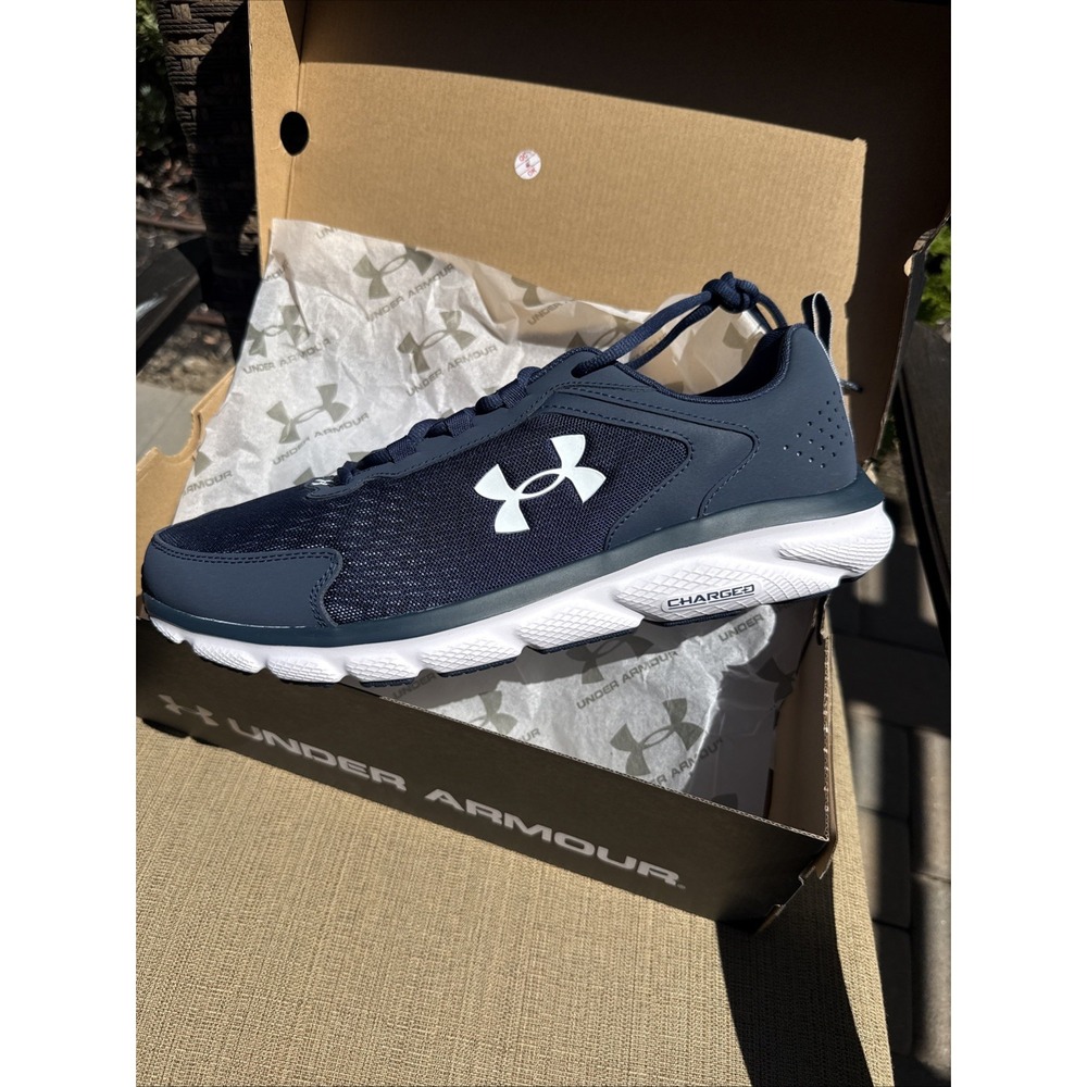 Size 15 - Under Armour Charged Assert 9 4E Wide Academy White